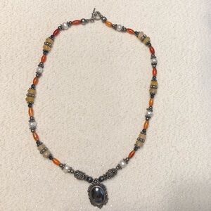 Handcrafted Silver Pendant Necklace with Orange and Cream Beads